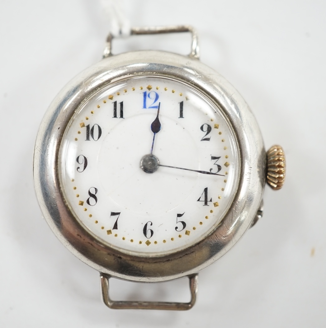 A George V silver manual wind wrist watch, with Arabic dial, no strap. Condition - poor